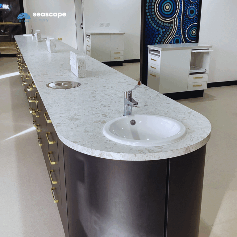 Island bench workspace with integrated sink, waste and power outlets