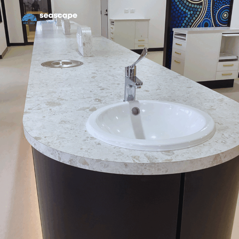 Island bench workspace with integrated sink, waste and power outlets